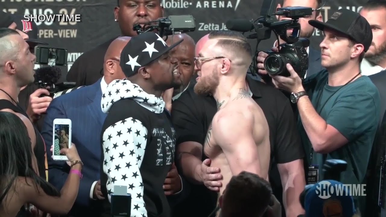 Floyd Mayweather makes it rain on Conor McGregor at the