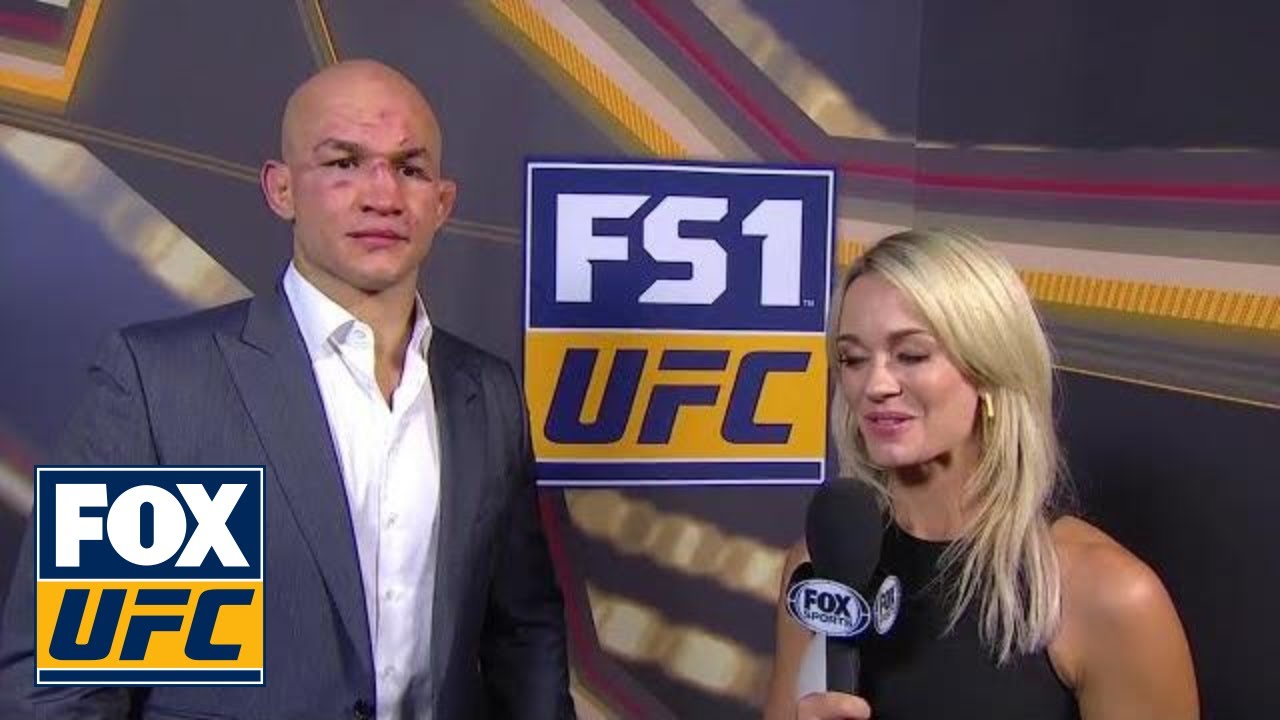 Junior Dos Santos stops and talks with Laura Sanko |