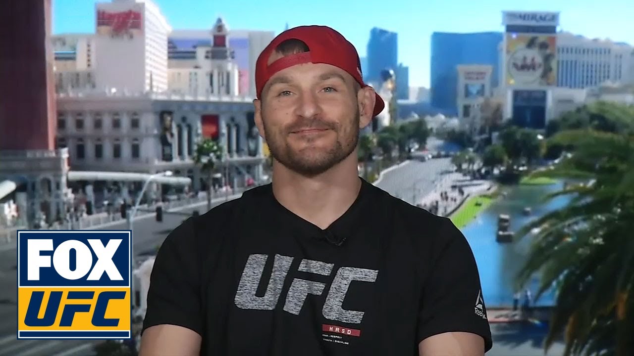 Stipe Miocic talks with Michael Bisping and Kenny Florian |