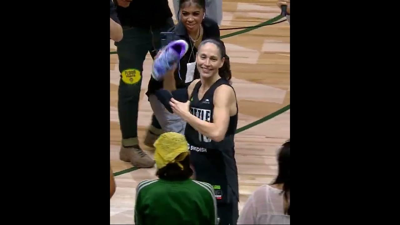 Sue Bird tossing her shoes to the crowd in her final regular season home game